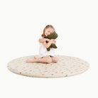Dinosauria (on sale)@little girl sitting on padded midi