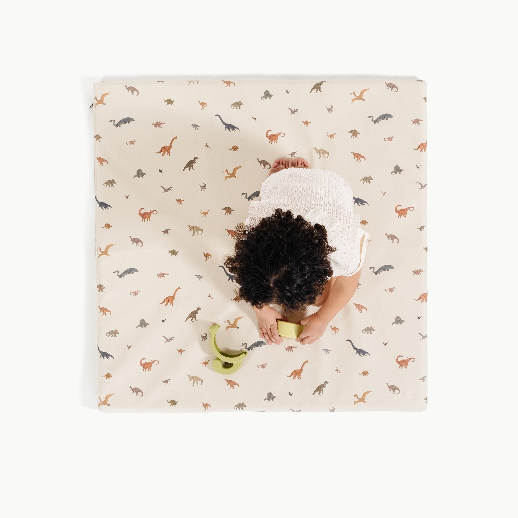 Dinosauria (on sale) / Square@overhead of little girl on padded mini
