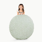 Flora (on sale)/ Circle@little girl holding a floor cushion