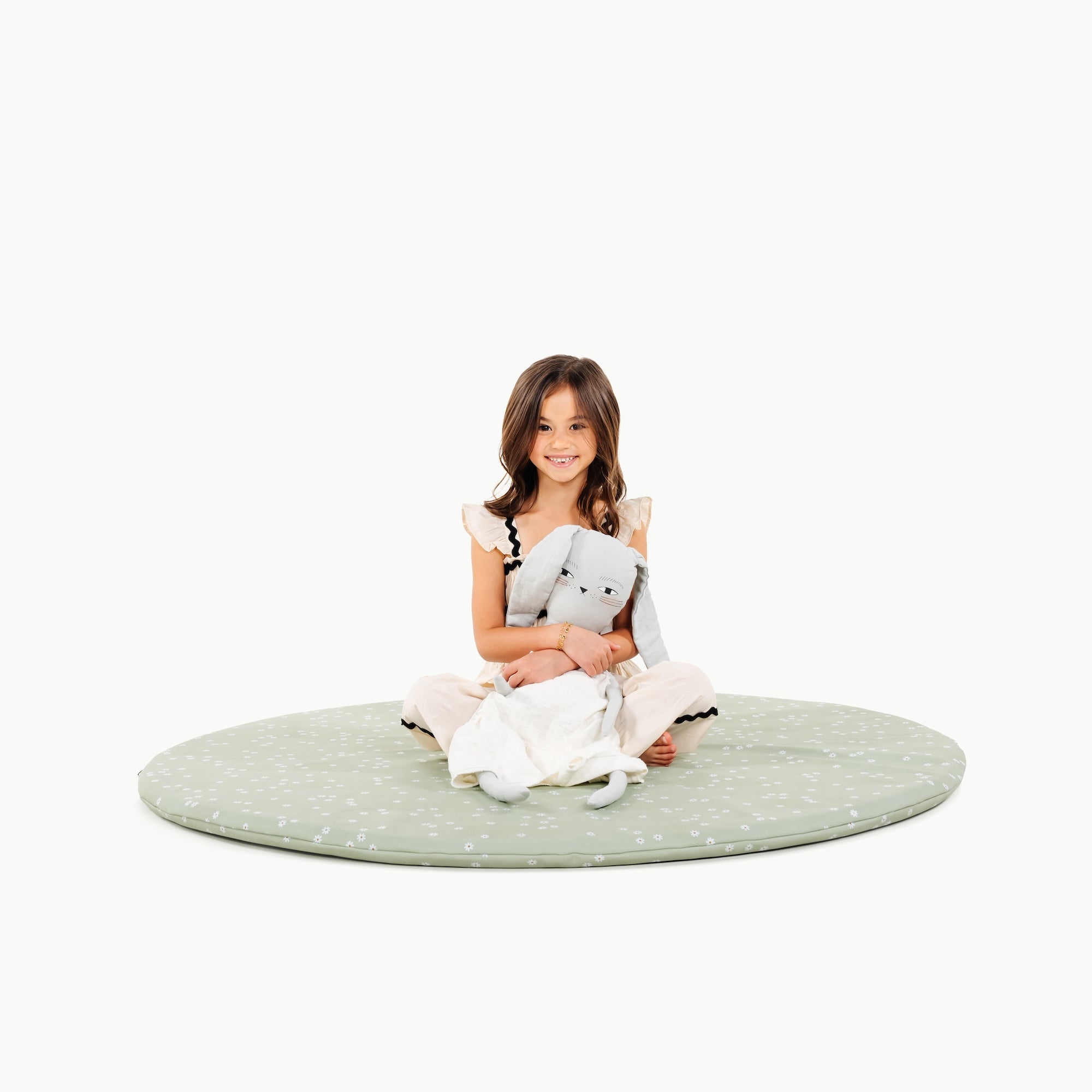 Flora (on sale)@little girl sitting on padded mat