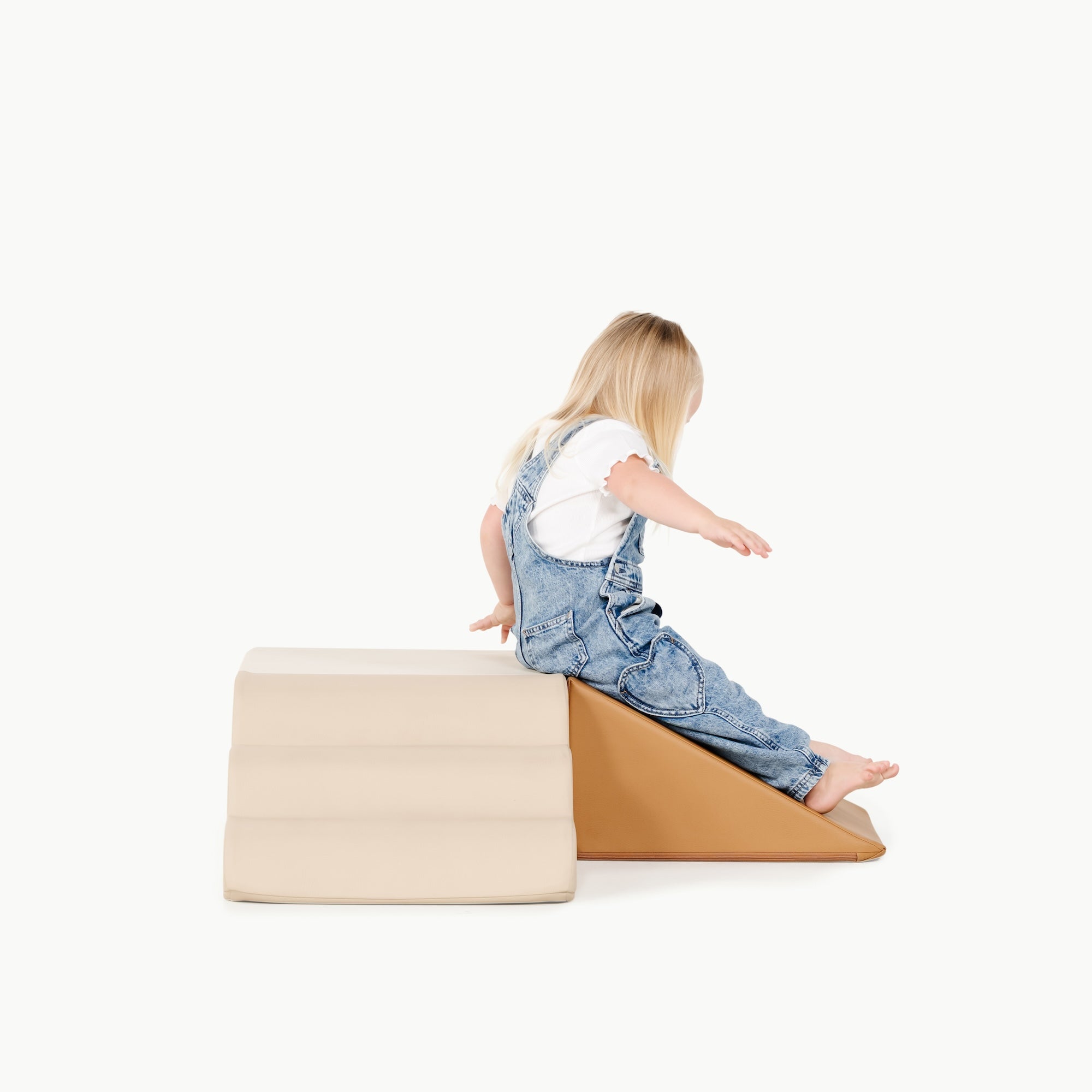 kid playing on the mini climber playset