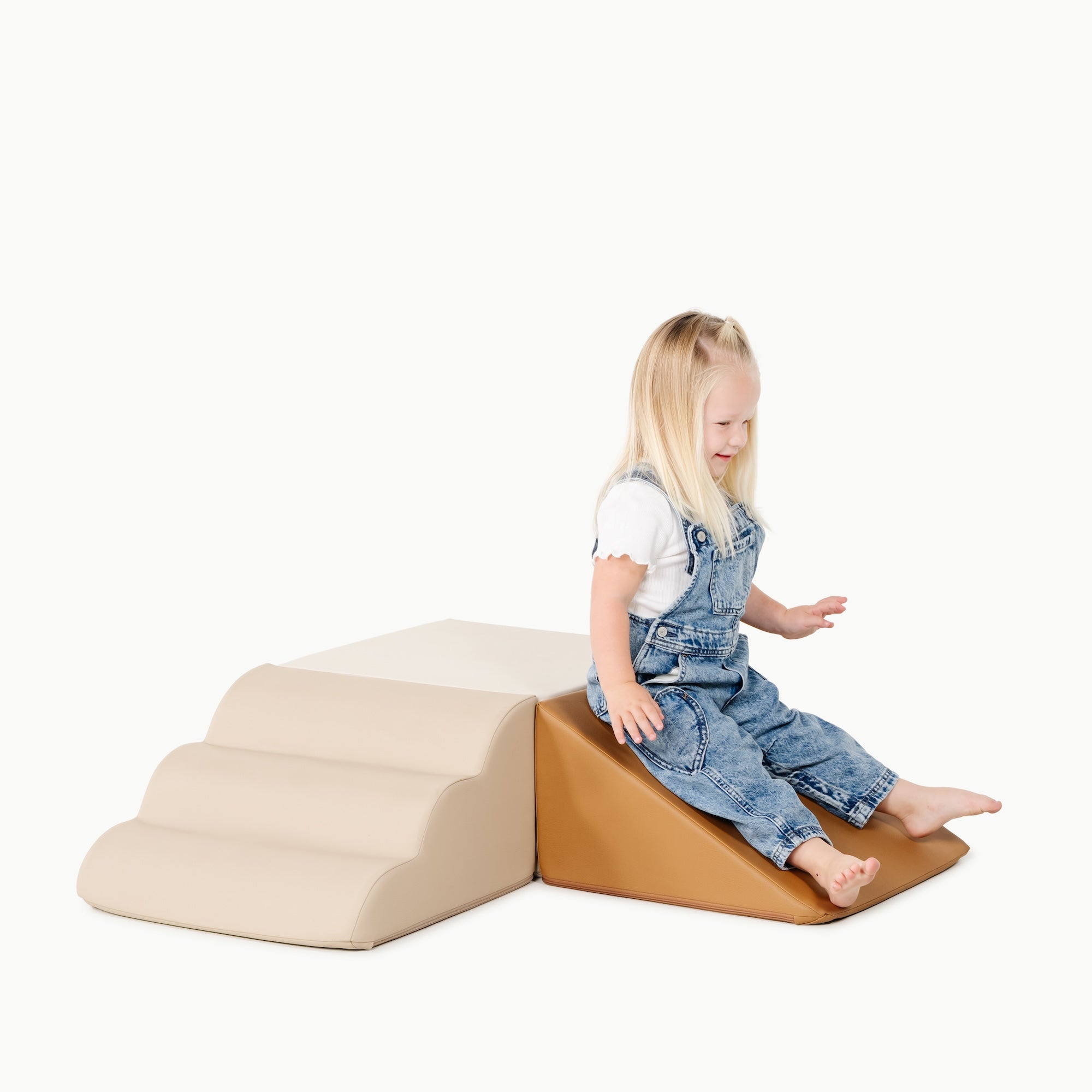 kid playing on the mini climber playset