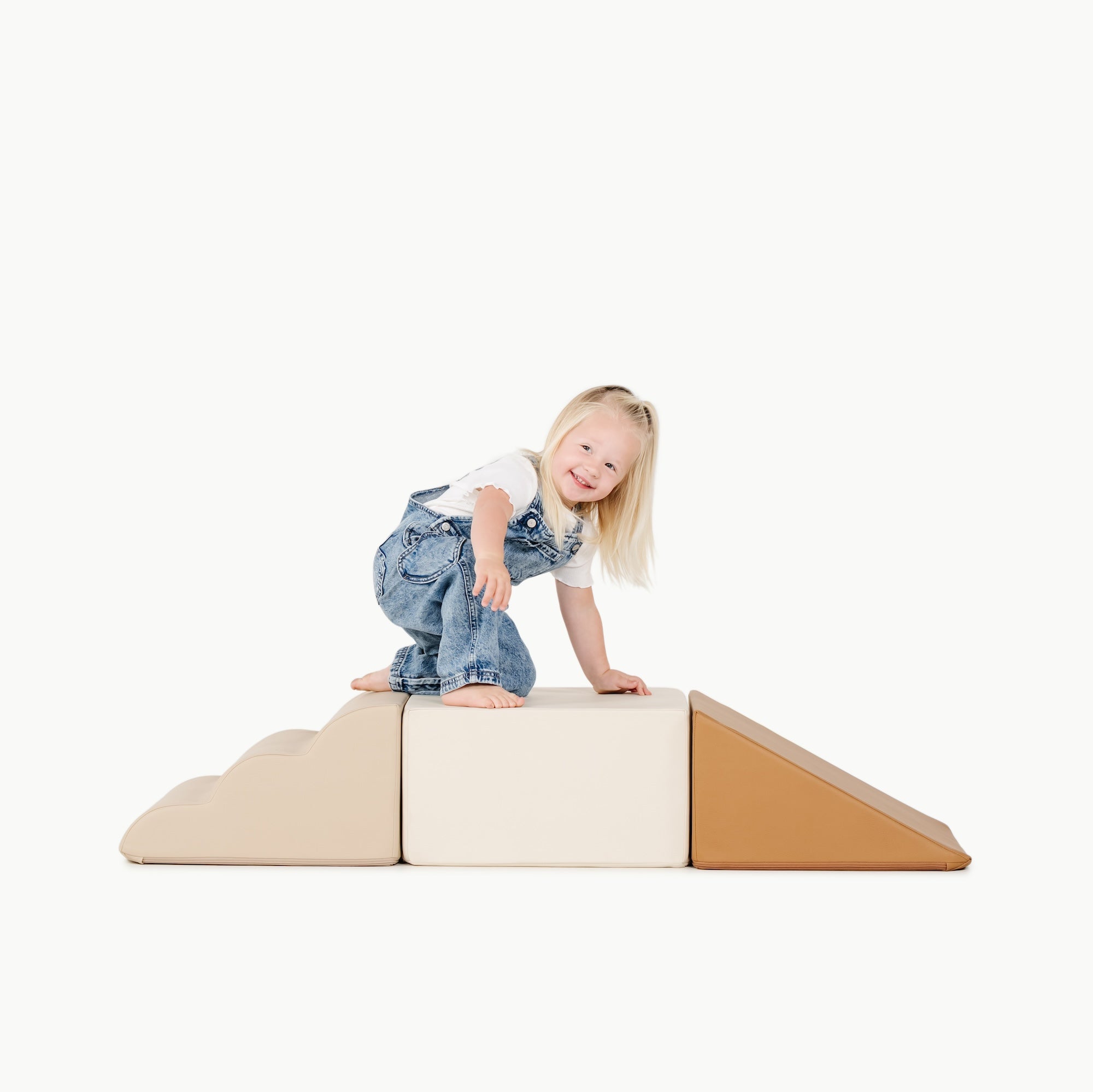 kid playing on the mini climber playset