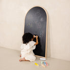 Beech@Child using a kids chalkboard for drawing and magnetic play at home