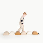Ivory • Millet • Camel@little boy playing with the hex hopper