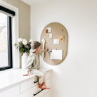 All@Modern pinboard styled in a shared home space for kids’ art and notes