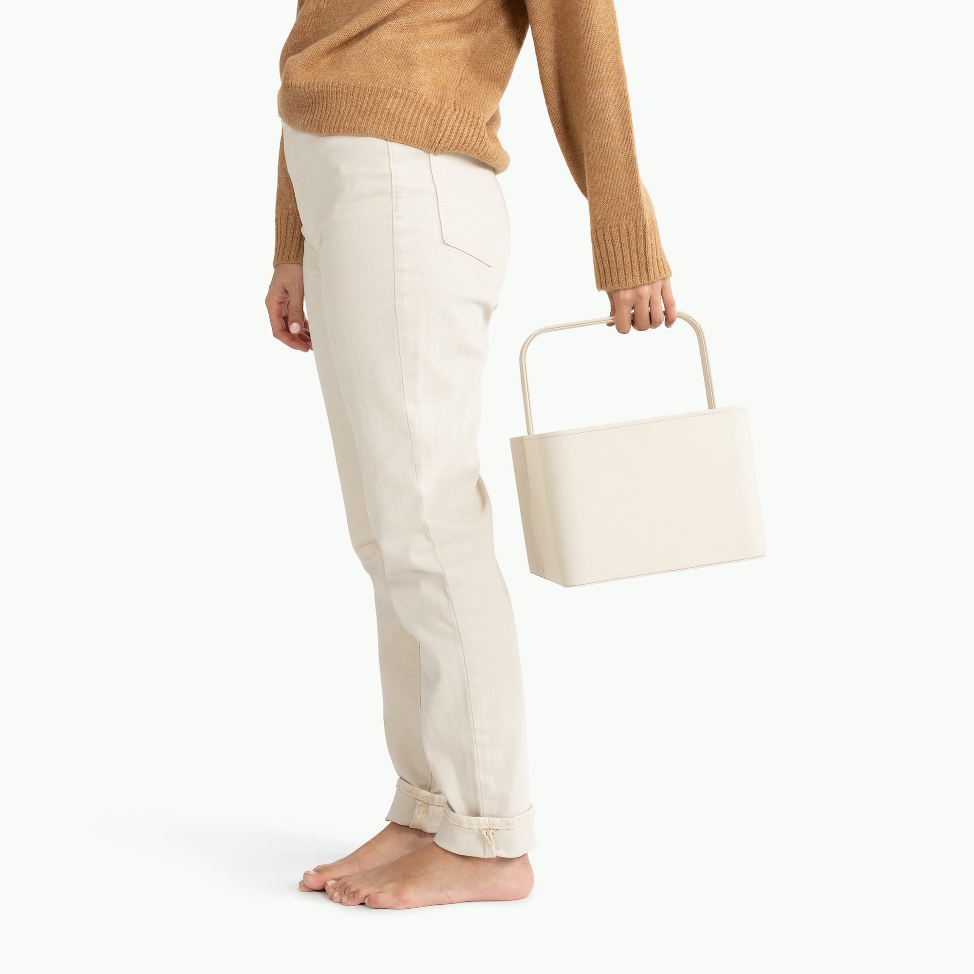 Ivory@Woman holding the Large Ivory Caddy