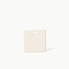 Ivory (on sale)@handle view of Medium Camel Storage Bin 