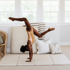Ivory@Child rolling and playing on a comfortable tumbling mat