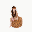 Leopard (on sale)@kid sitting on the leopard circle pouf