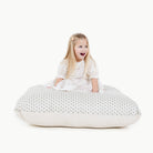 Meadow (on sale) / Square@kid sitting on the meadow square floor cushion