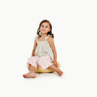 Mellow (on sale) / Circle@little girl sitting on a mini cushion