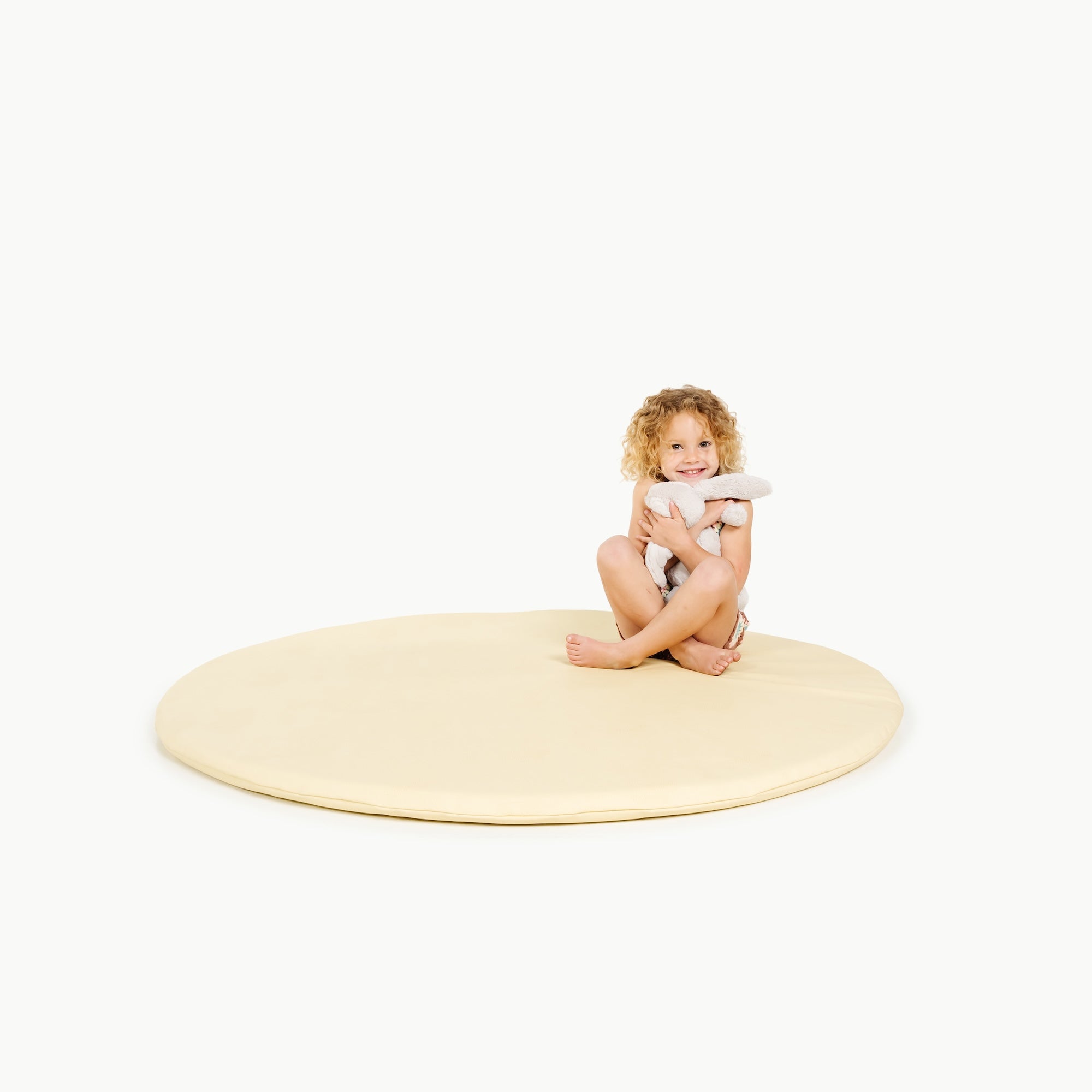 Mellow (on sale)@little girl sitting on padded mat