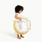 Mellow (on sale)@toddler holding folded tunnel
