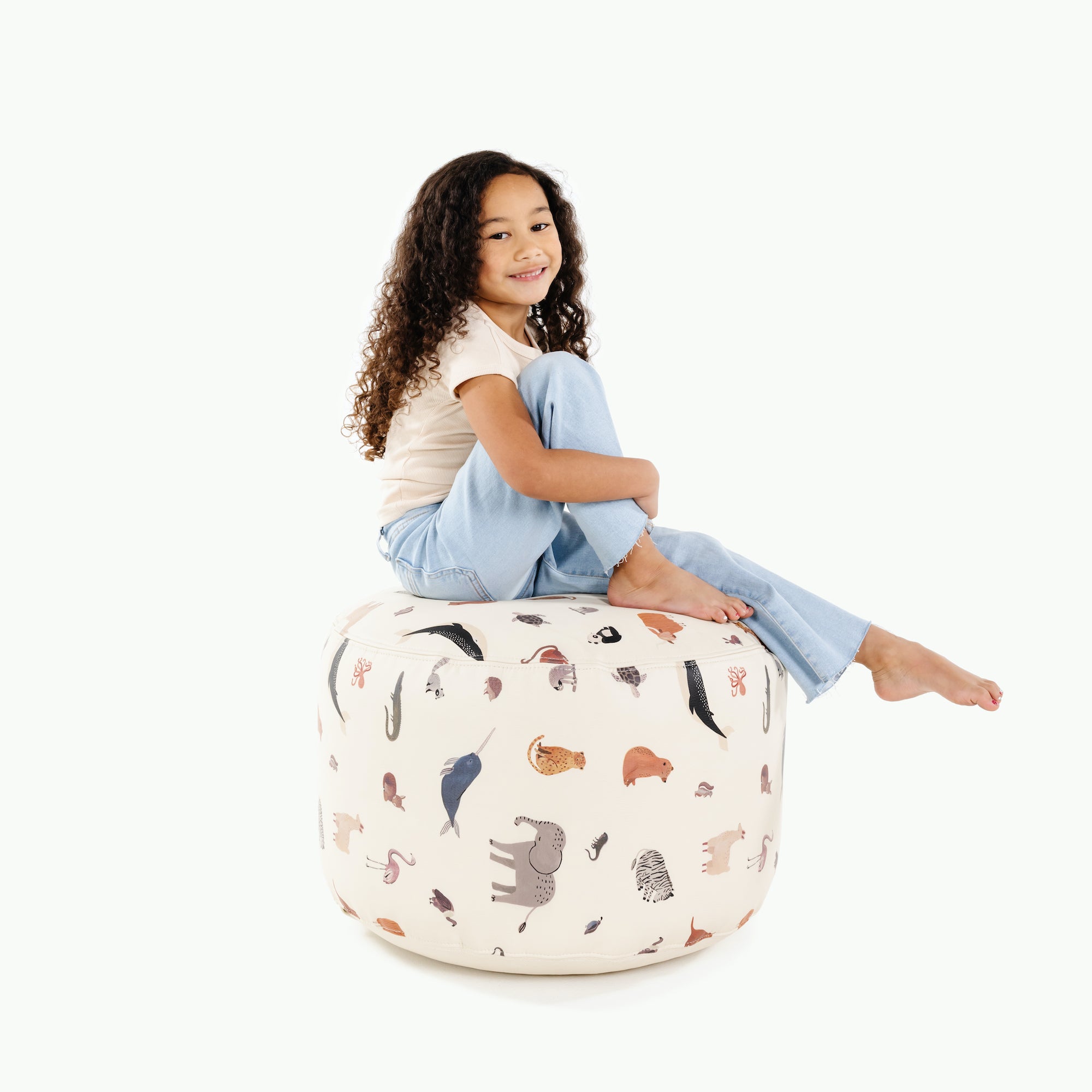 Menagerie (on sale)@kid sitting on the menagerie circle pouf