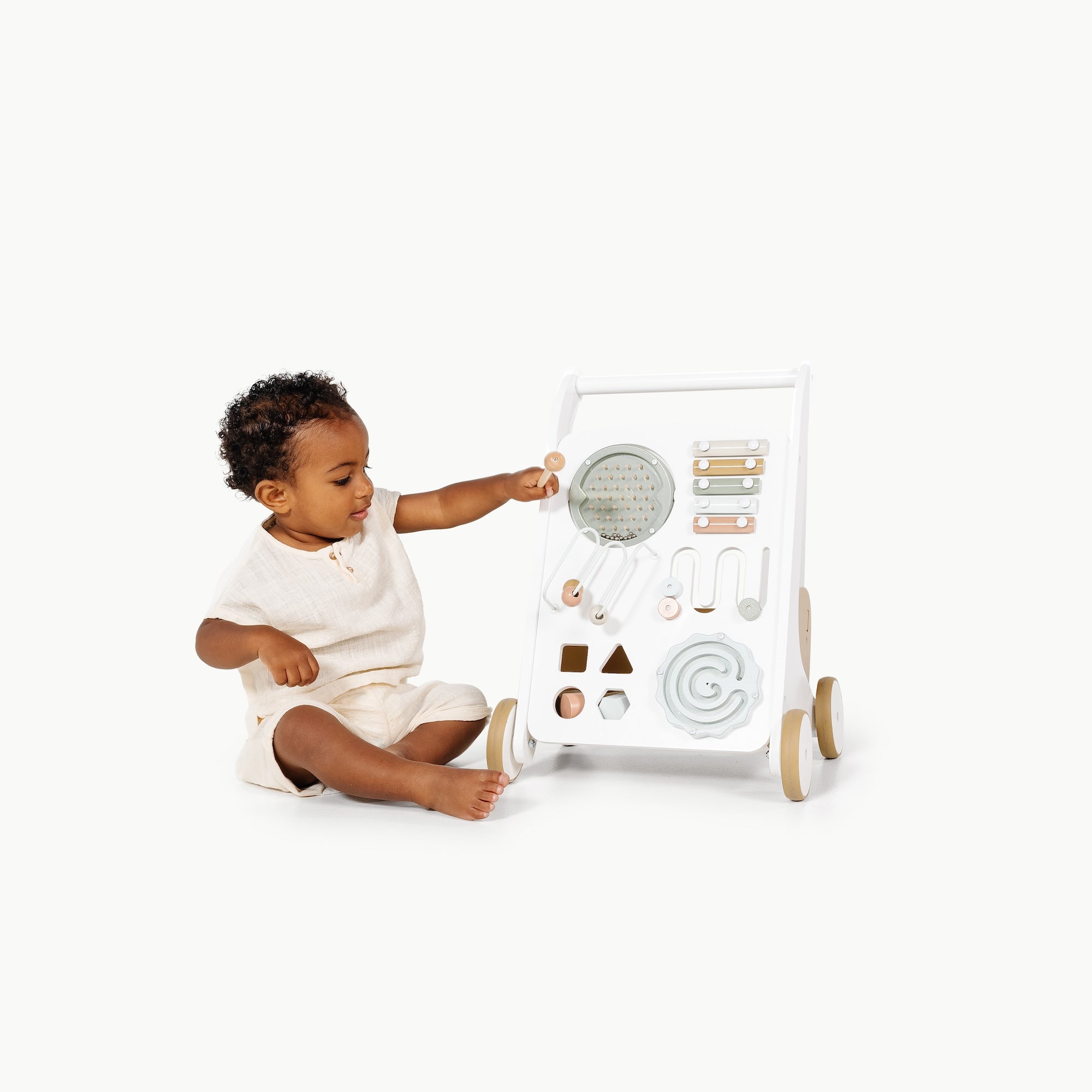 Biscotti (on sale)@little boy playing with activity walker