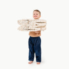 Paris (on sale)@kid holding the paris ball pit folded up
