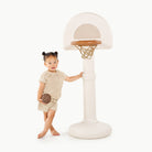 Ivory@Toddler using a basketball hoop to practice coordination and movement