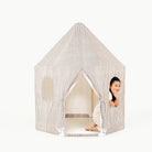 Stone Stripe@little girl sitting in the play tent