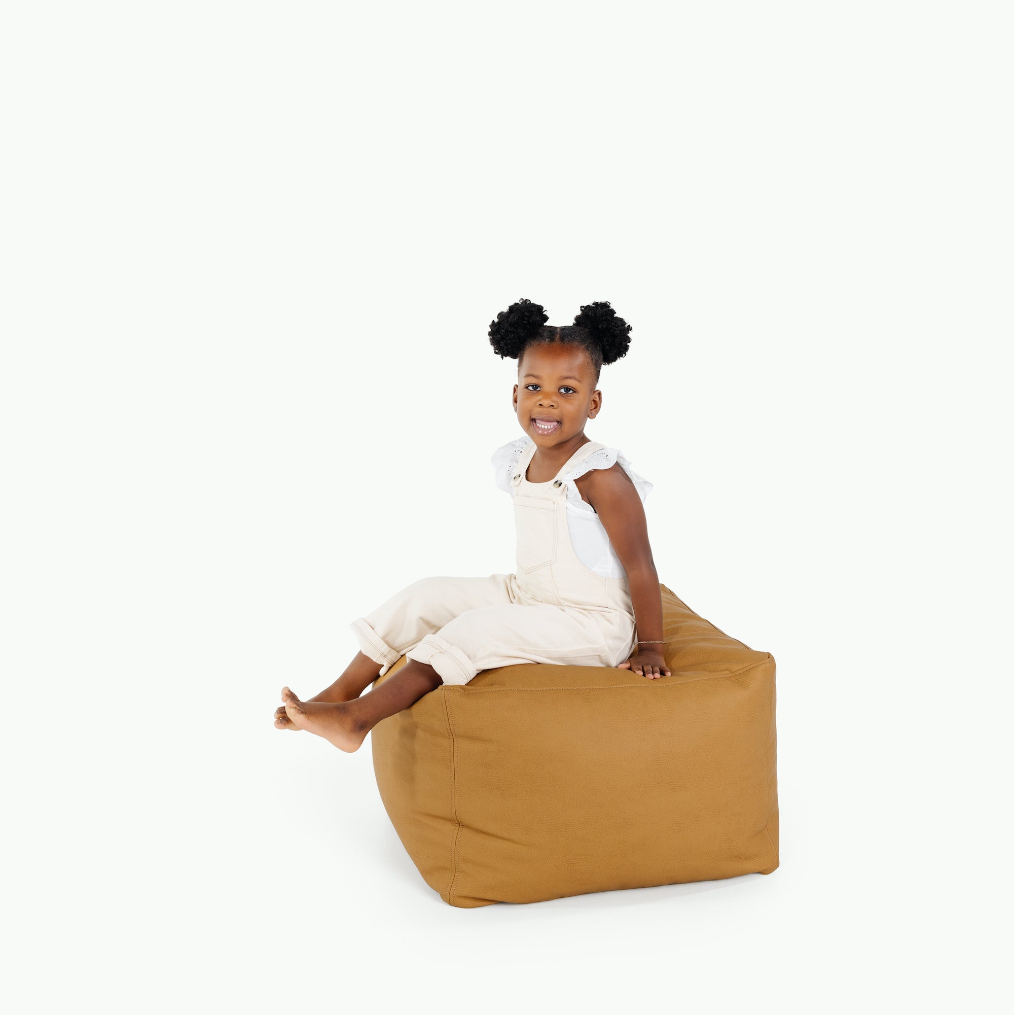 Tassel (on sale)@little girl sitting on pouf