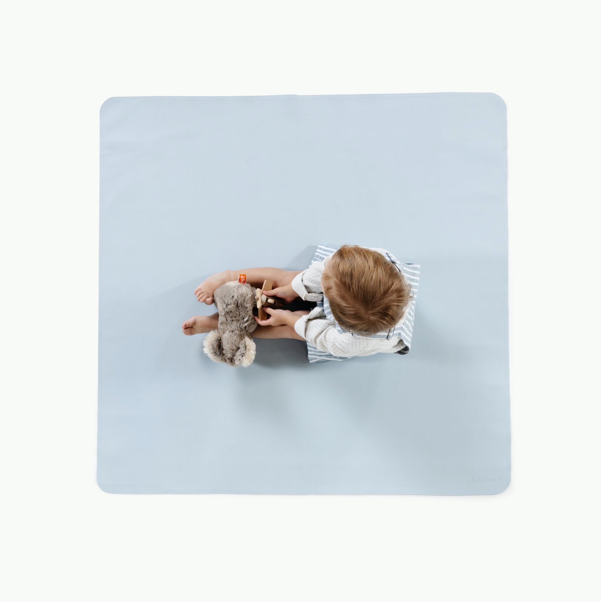Beau@Overhead baby sitting on the Beau Mini Mat