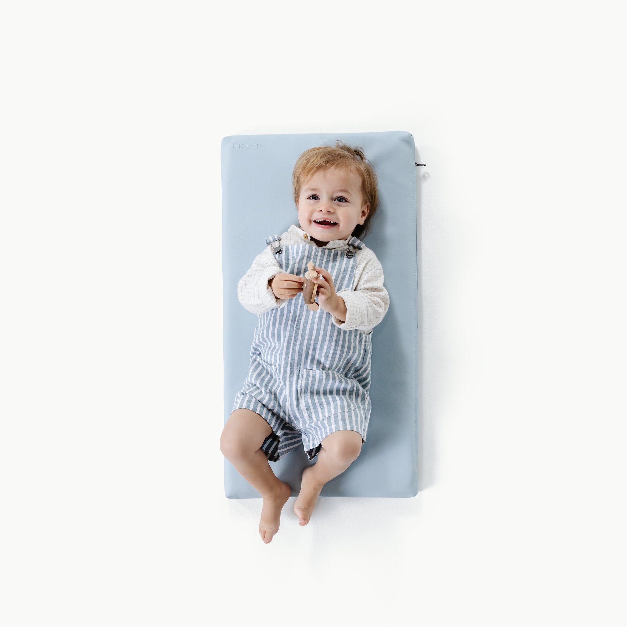 Beau (on sale)@overhead of baby on Beau Padded micro+