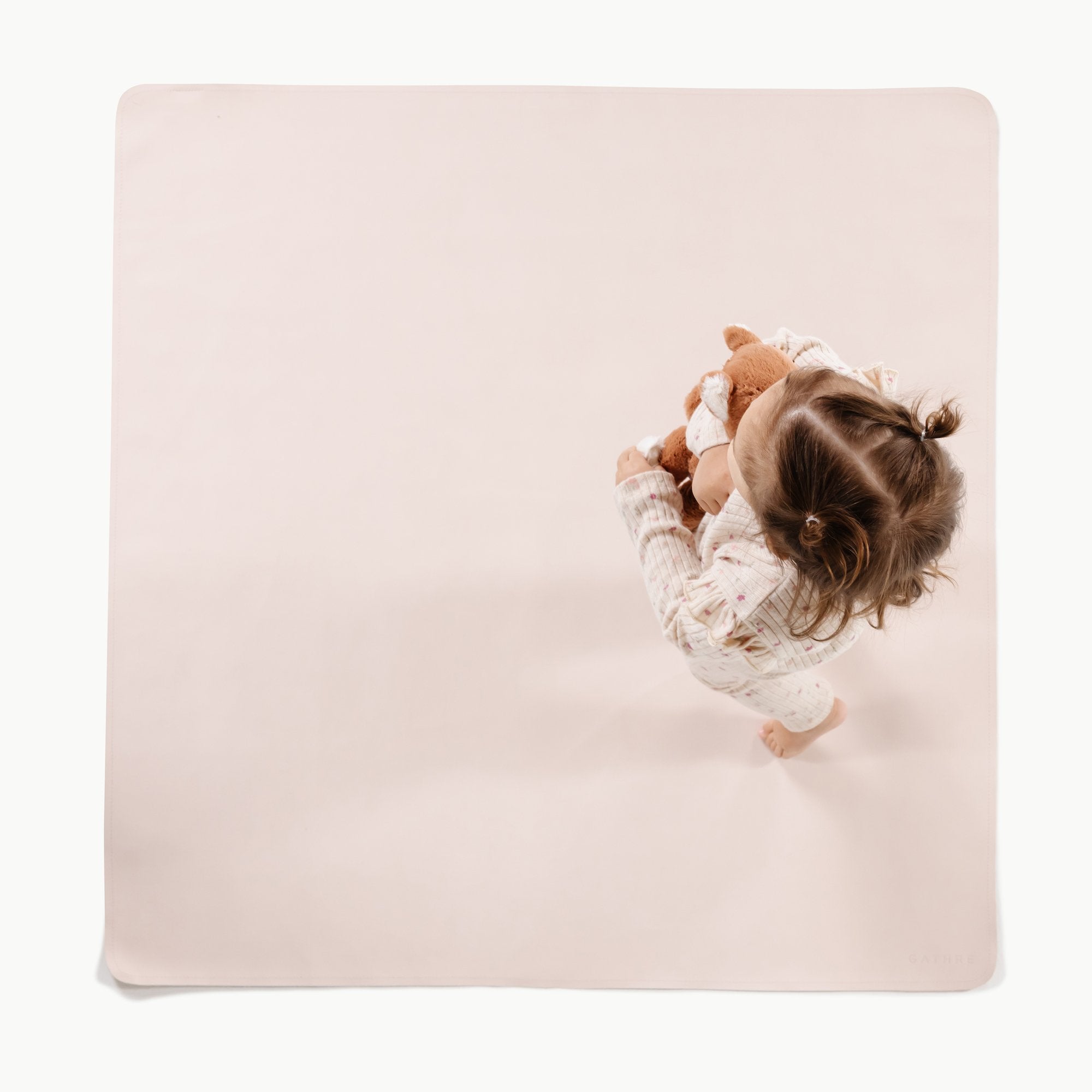 Belle@Overhead baby standing on the Belle Mini Mat