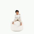 Blanc (on sale)@Kid sitting on the Blanc Circle Pouf