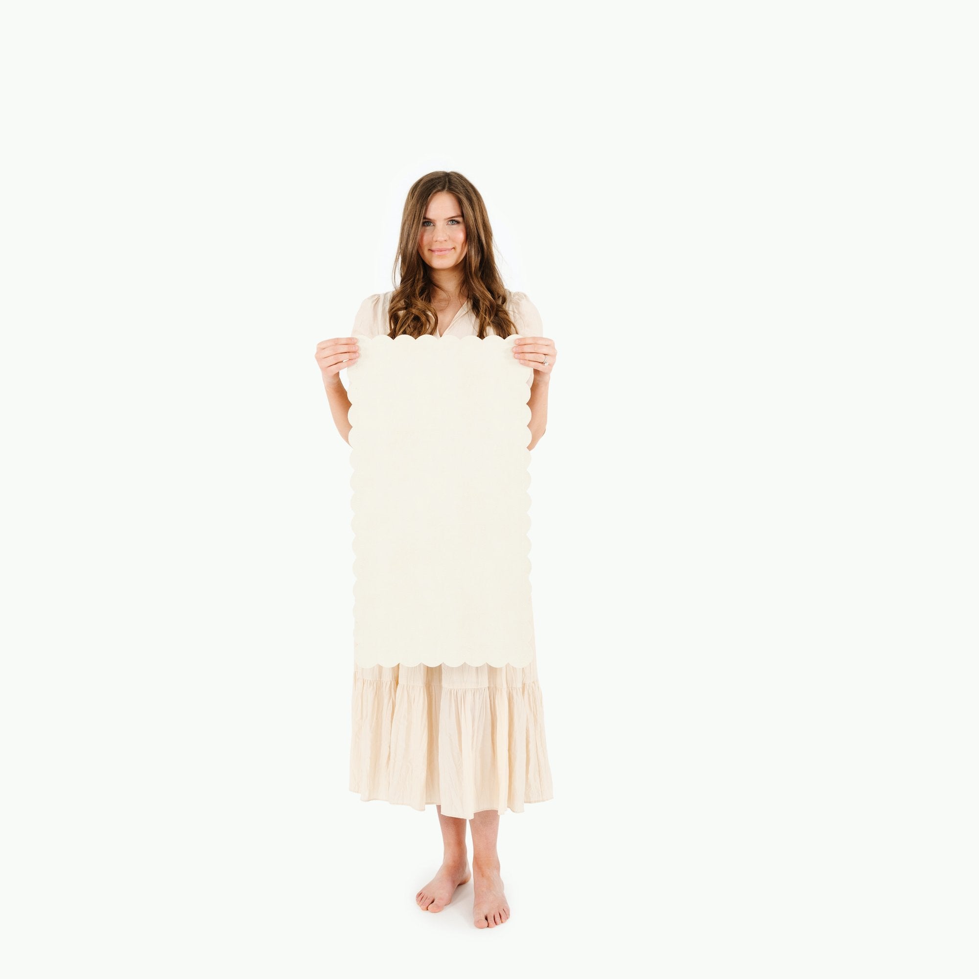 Ivory Scallop@Woman holding the Ivory Scallop Micro+ Mat