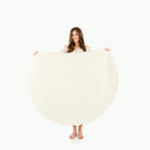 Ivory Scallop / Circle@Woman holding the Ivory Scallop Circle Midi Mat
