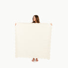 Blanc Scallop (on sale) / Square@woman holding the blanc scallop midi mat 