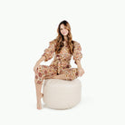 Bloom (on sale)@Woman sitting on the Bloom Circle Pouf