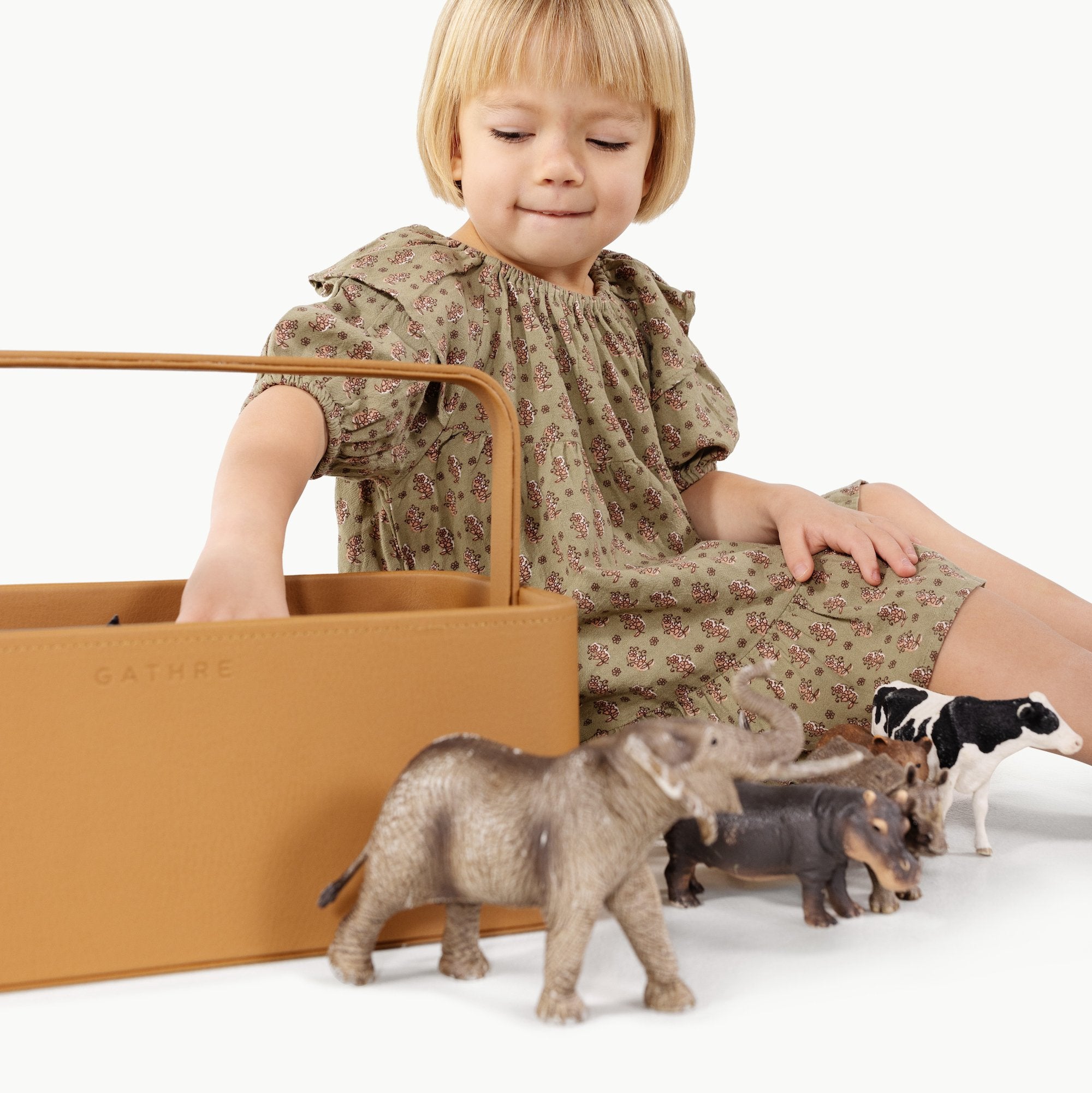 Camel@Kid playing with toys in the small camel caddy