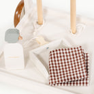 Ivory@detailed image of some of the accessories on the cleaning cart