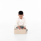 Millet@Kid playing with toys in the small millet caddy