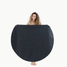 Raven (on sale) / Circle@Woman holding the Raven Circle Midi Mat