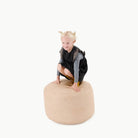 Untanned (on sale)@Kid sitting on the Untanned Circle Pouf