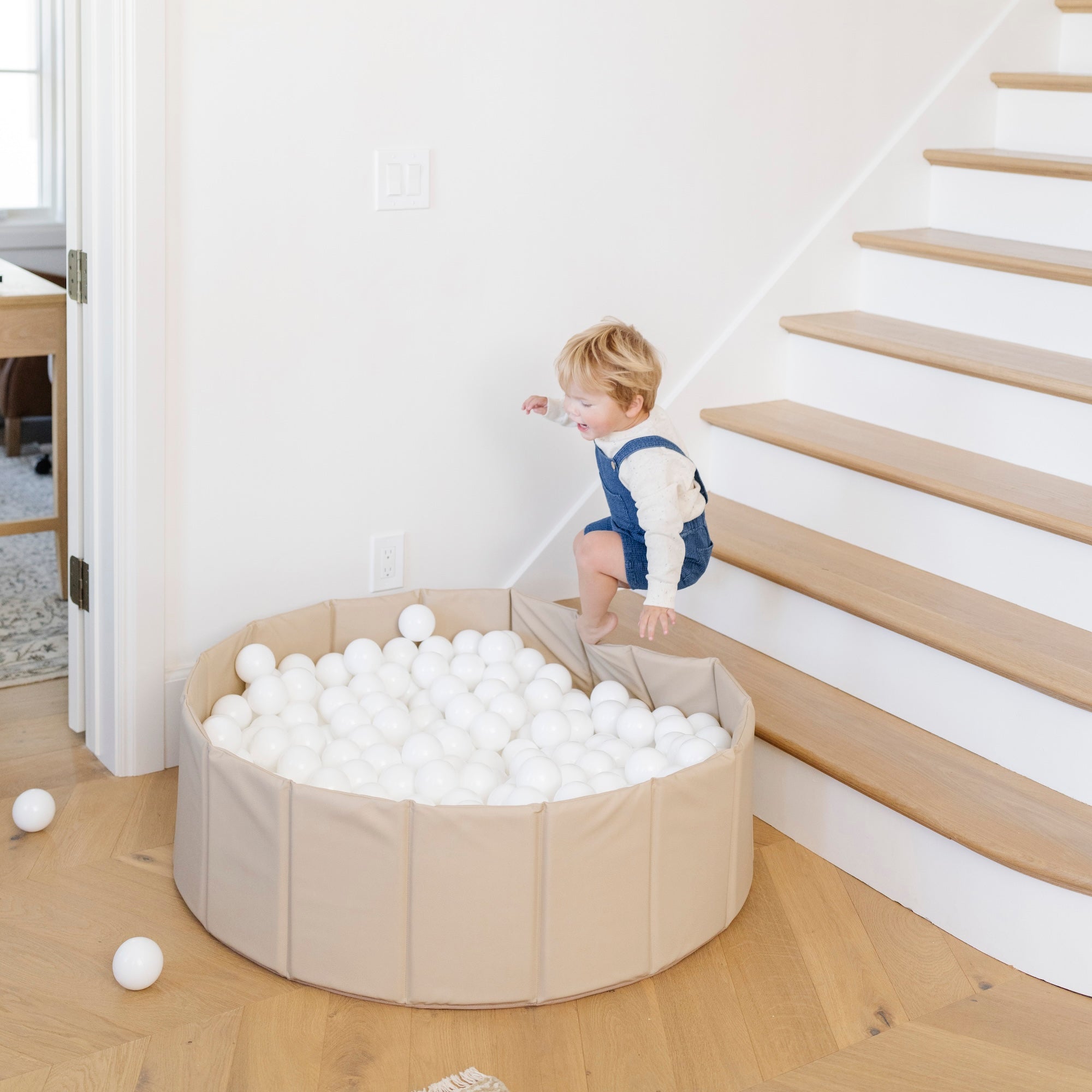 Millet@Modern ball pit styled in a neutral living room for kids’ play