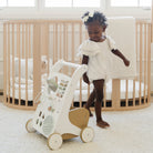 Biscotti (on sale)@little girl playing with activity walker