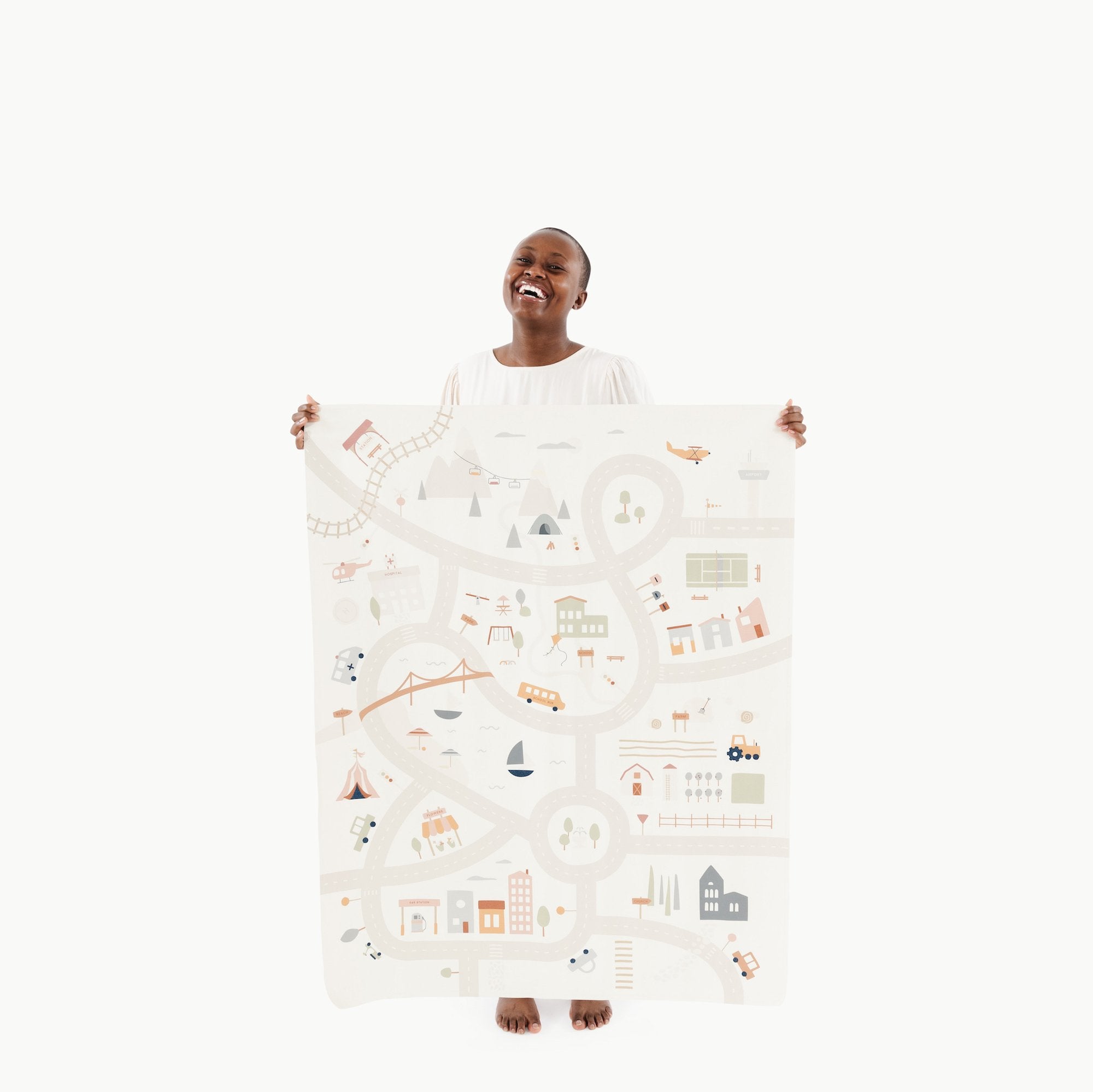 Boulevard@Woman holding the Boulevard Mini+ Mat
