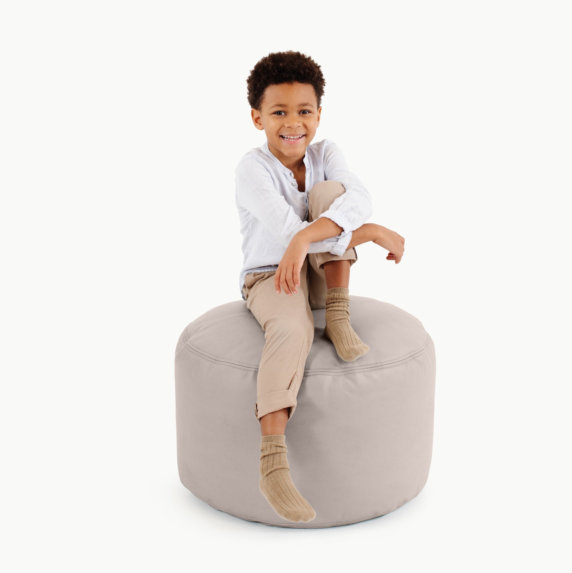 Gull (on sale)@kid sitting on the  Gull Circle Pouf