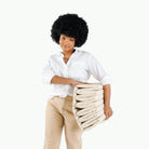 Ivory@Woman holding the folded up Ivory Ball Pit