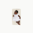 Ivory@Overhead baby sitting on the Ivory Micro+ Mat