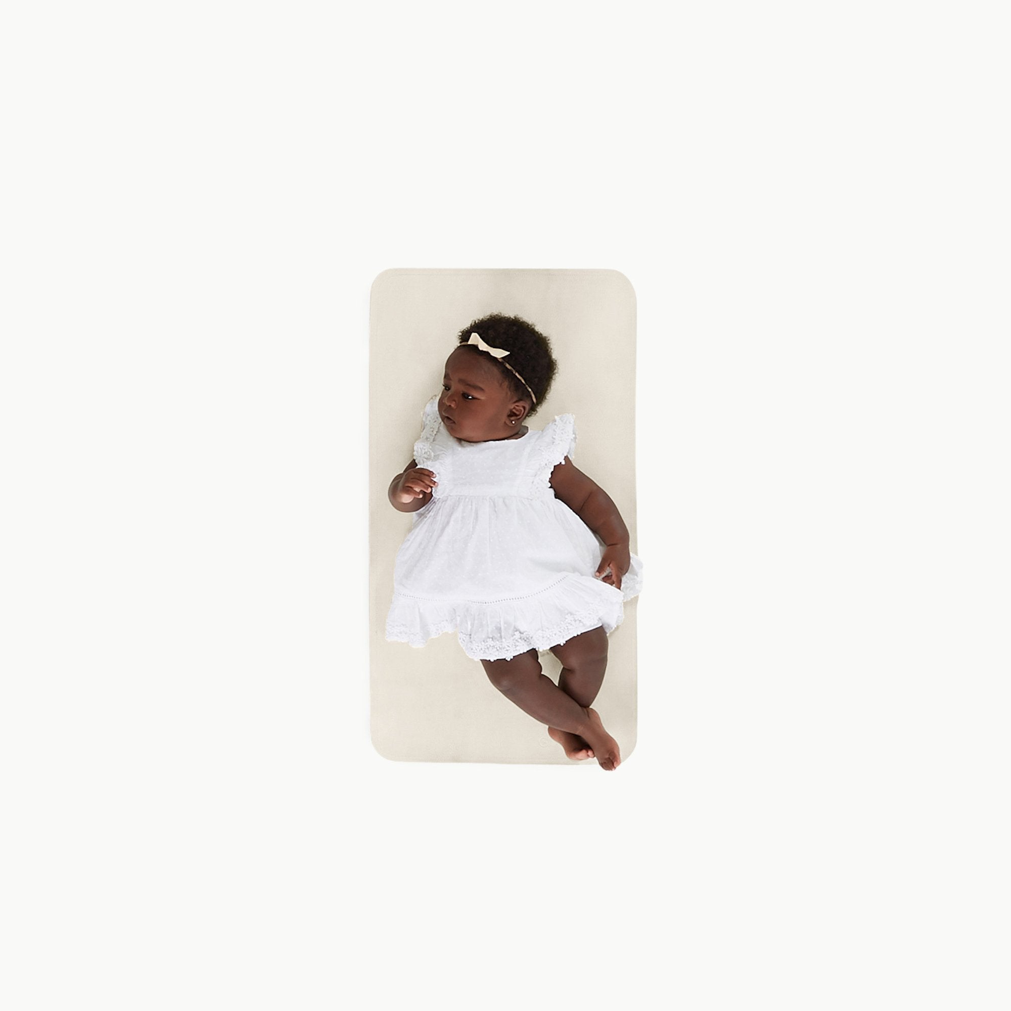 Ivory@Overhead baby sitting on the Ivory Micro+ Mat