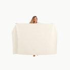 Ivory@Woman holding the Ivory Midi+ Mat
