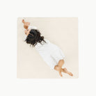 Ivory / Square@Overhead kid sitting on the Ivory Midi Square Mat 