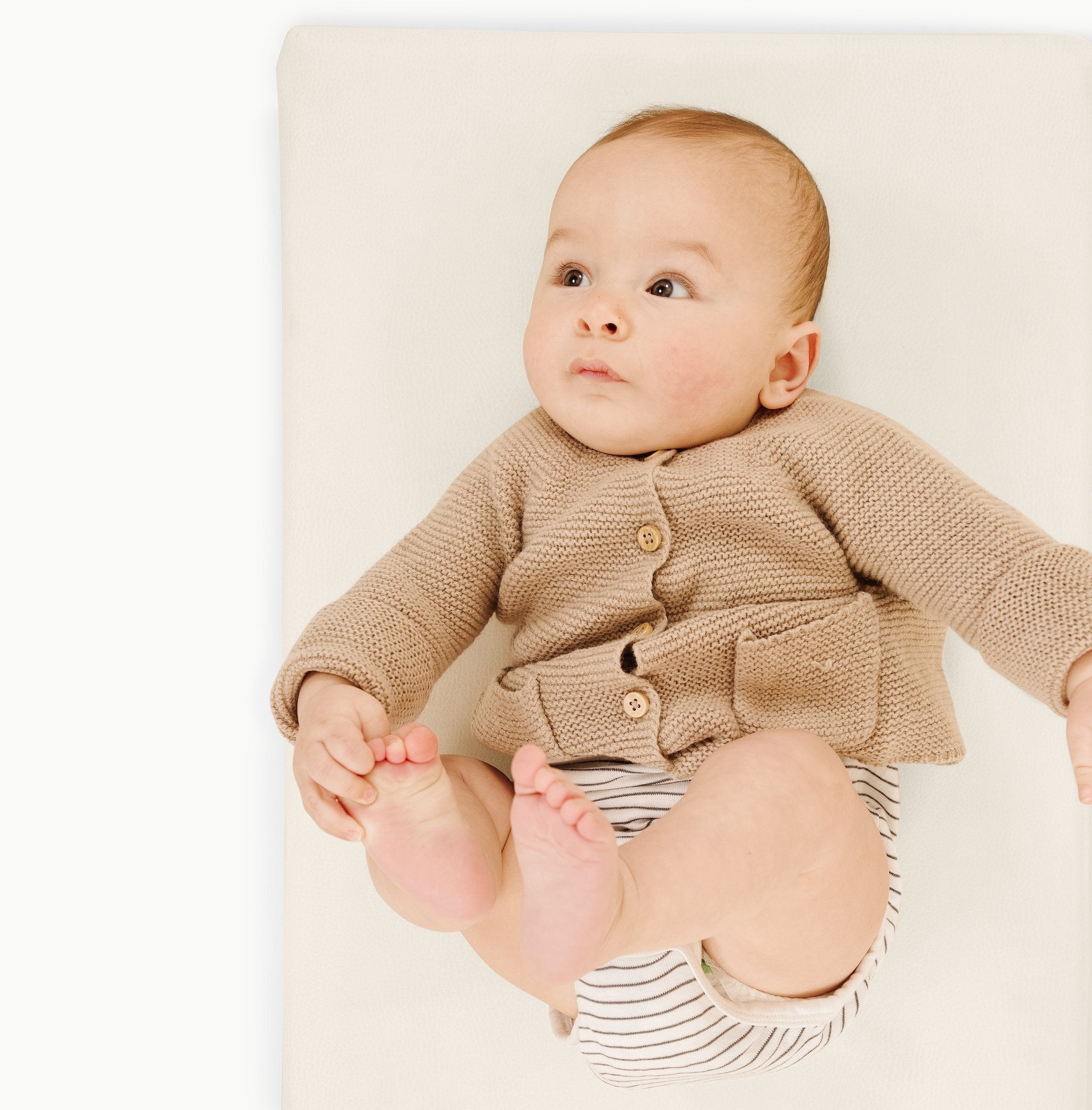 Ivory@Baby laying on Ivory Padded micro+
