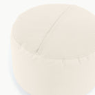 Ivory@Detail shot of perforated side of Ivory Circle Pouf 