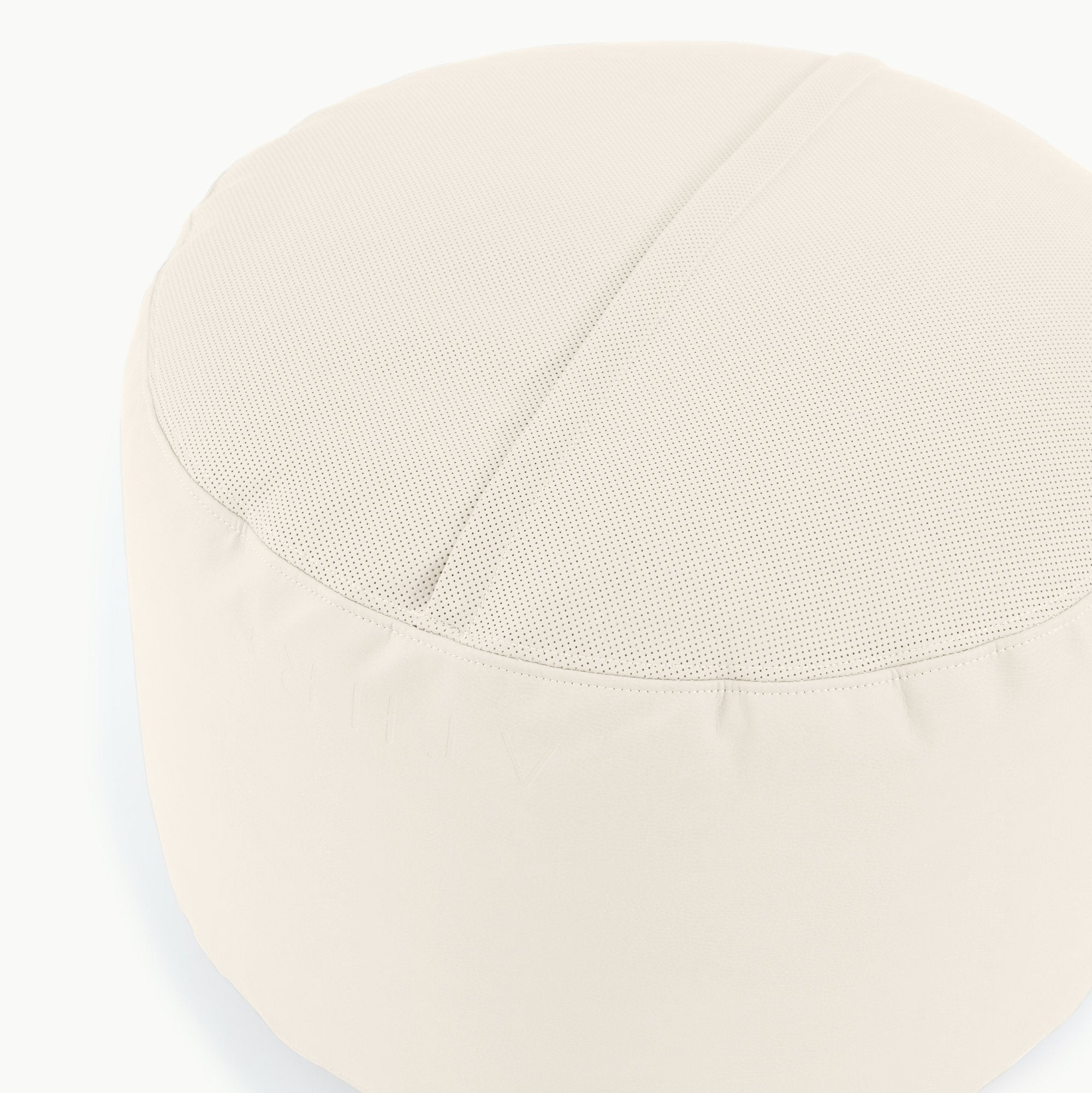 Ivory@Detail shot of perforated side of Ivory Circle Pouf 