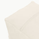 Ivory@Detail shot of perforated side of Ivory Square Pouf  